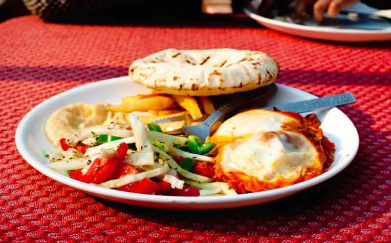 In a plane served some israeli food including chappati, salads and more