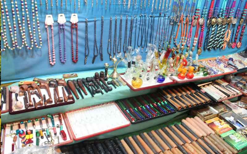 Cannabis container and chain hang on the wall arrange in a systematic way in the Kasol markets for shopping